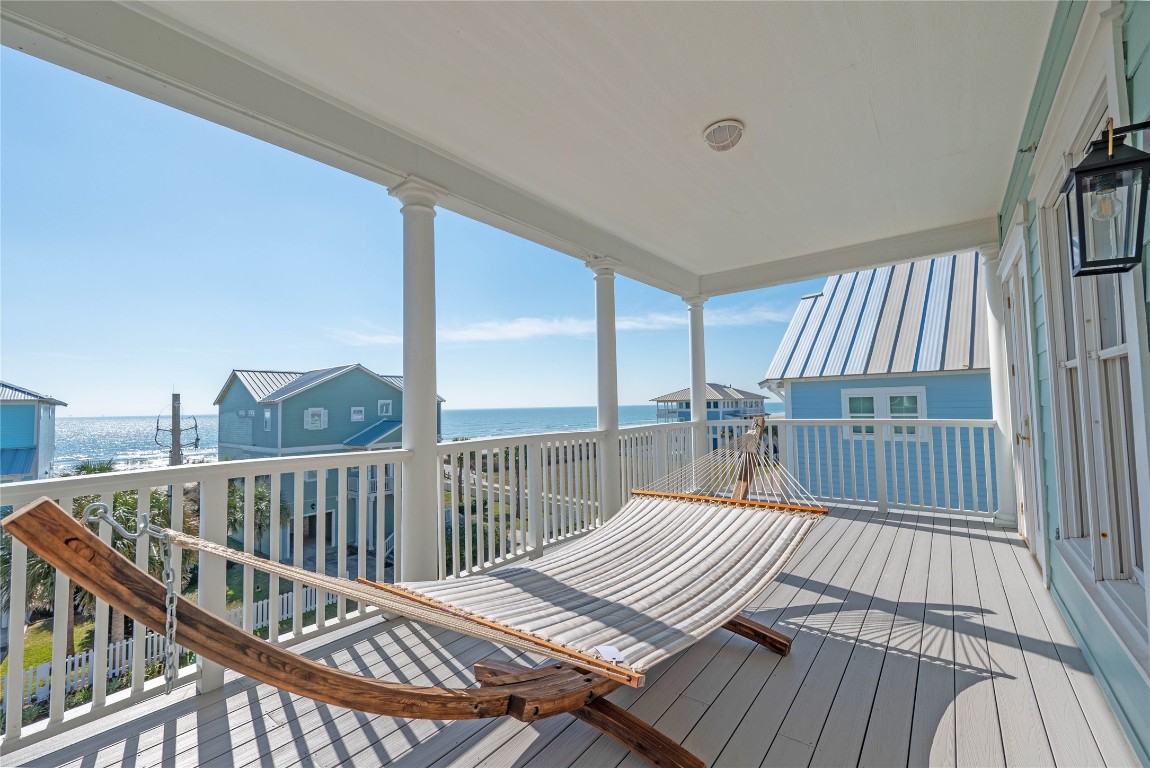 11610 Beachside Galveston, TX 77554 - Photo 35 of 50 a view of balcony with wooden floor