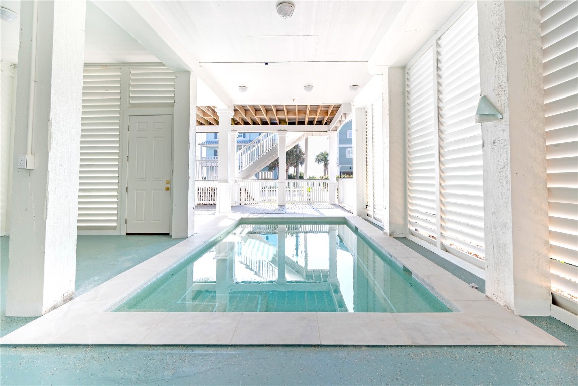11610 Beachside Galveston, TX 77554 - Photo 4 of 50 A covered pool creates the perfect space for effortless entertaining after a day at the beach.