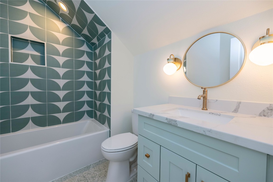 11610 Beachside Galveston, TX 77554 - Photo 43 of 50 a bathroom with a sink a toilet and bathtub