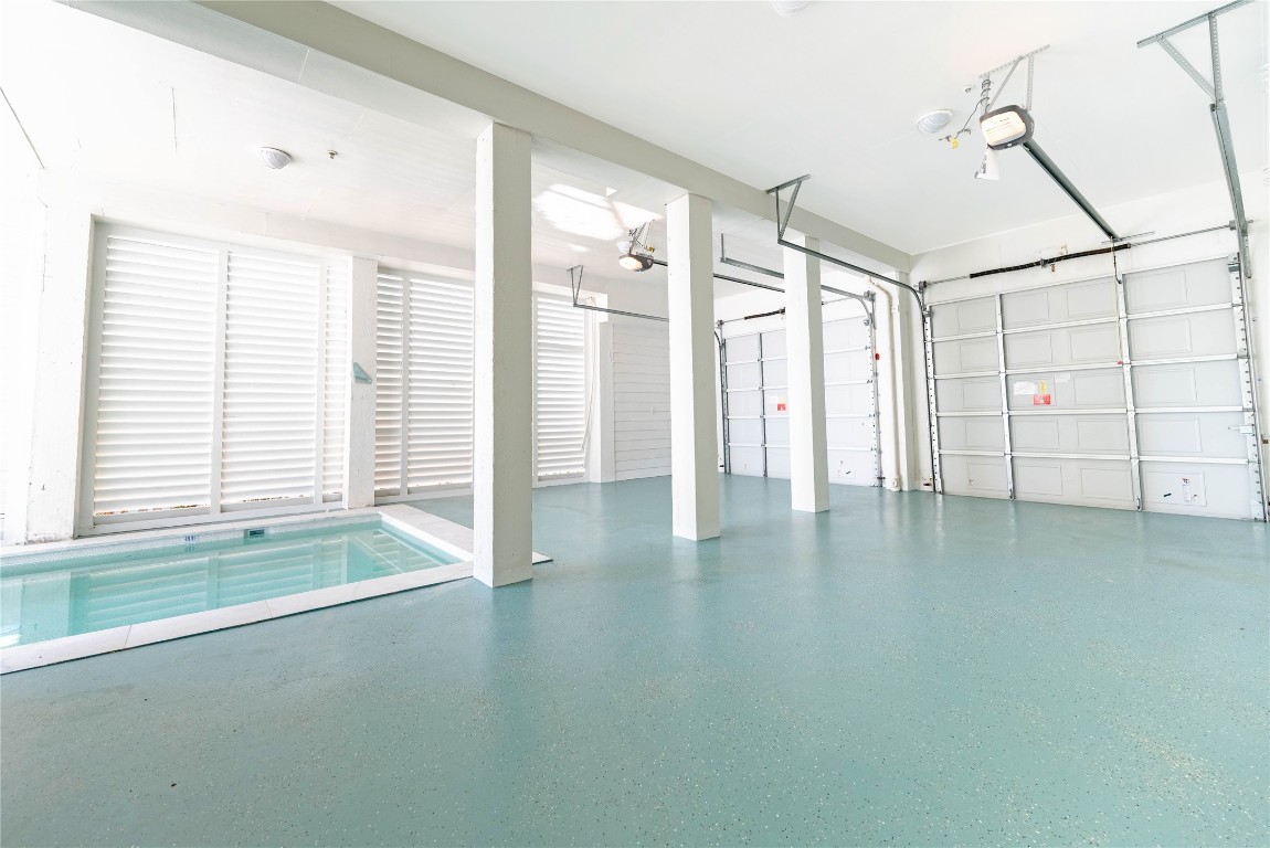11610 Beachside Galveston, TX 77554 - Photo 46 of 50 a view of empty room with wooden floor and fan