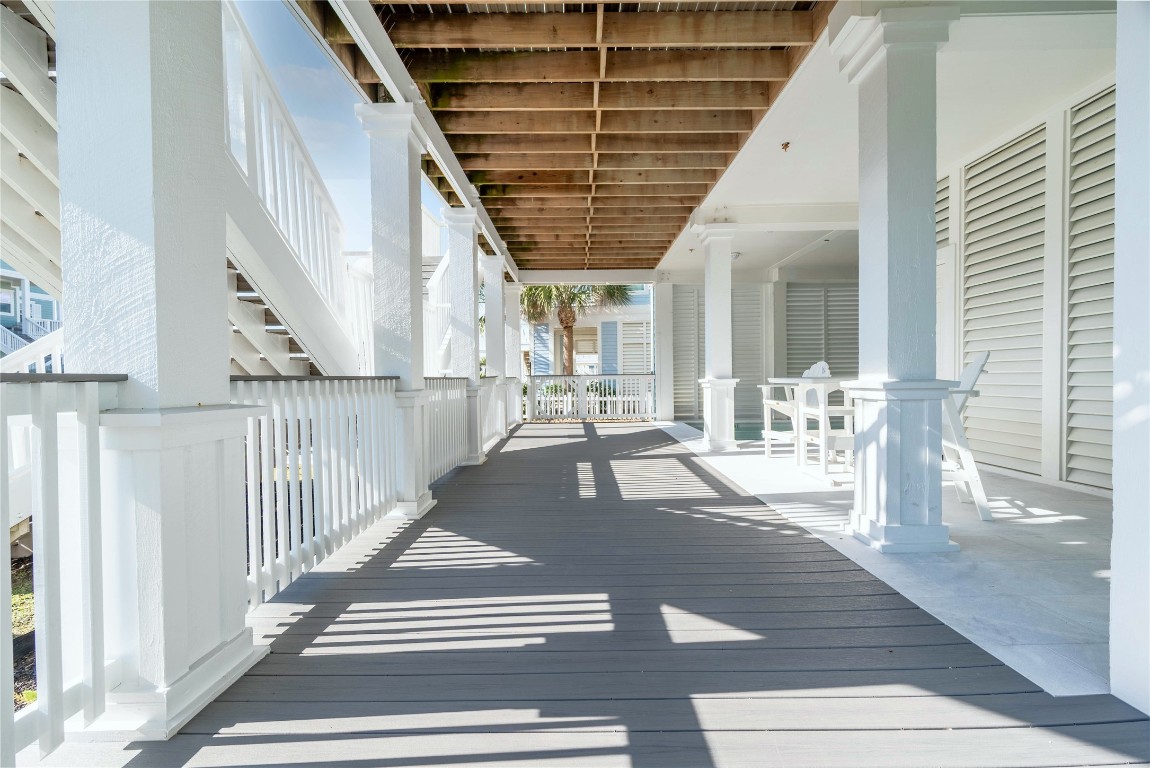 11610 Beachside Galveston, TX 77554 - Photo 48 of 50 The covered ground-floor patio features Trex decking, carried throughout all levels of the home.