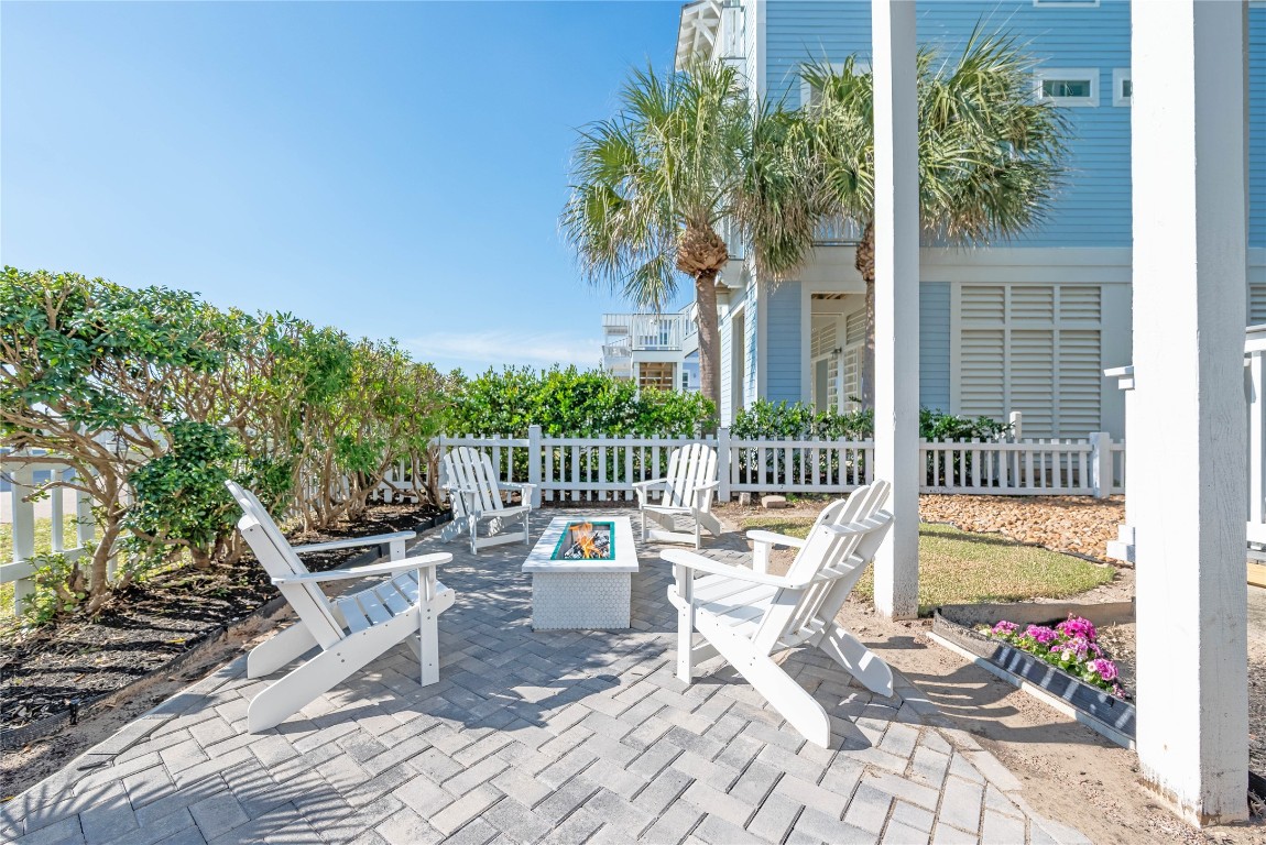 11610 Beachside Galveston, TX 77554 - Photo 50 of 50 a view of a chair and tables in the patio