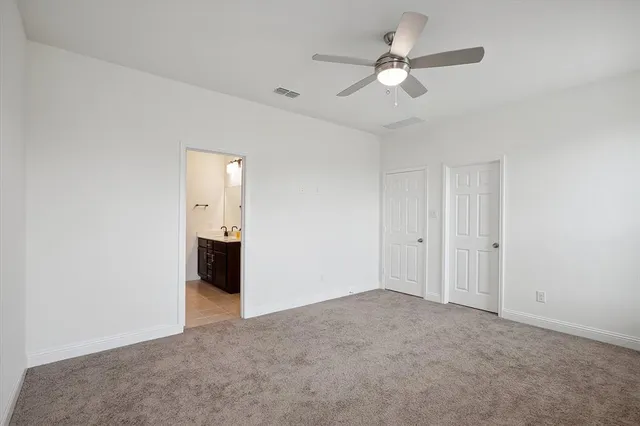 a view of a big room with carpet