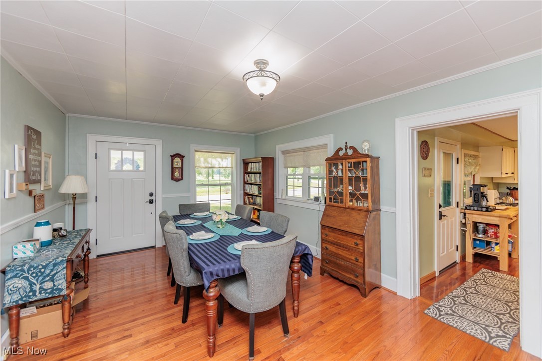 2550 North Ridge Road Vermilion, OH 44089 - Photo 17 of 50 Dining space featuring light hardwood / wood-style flooring and crown molding