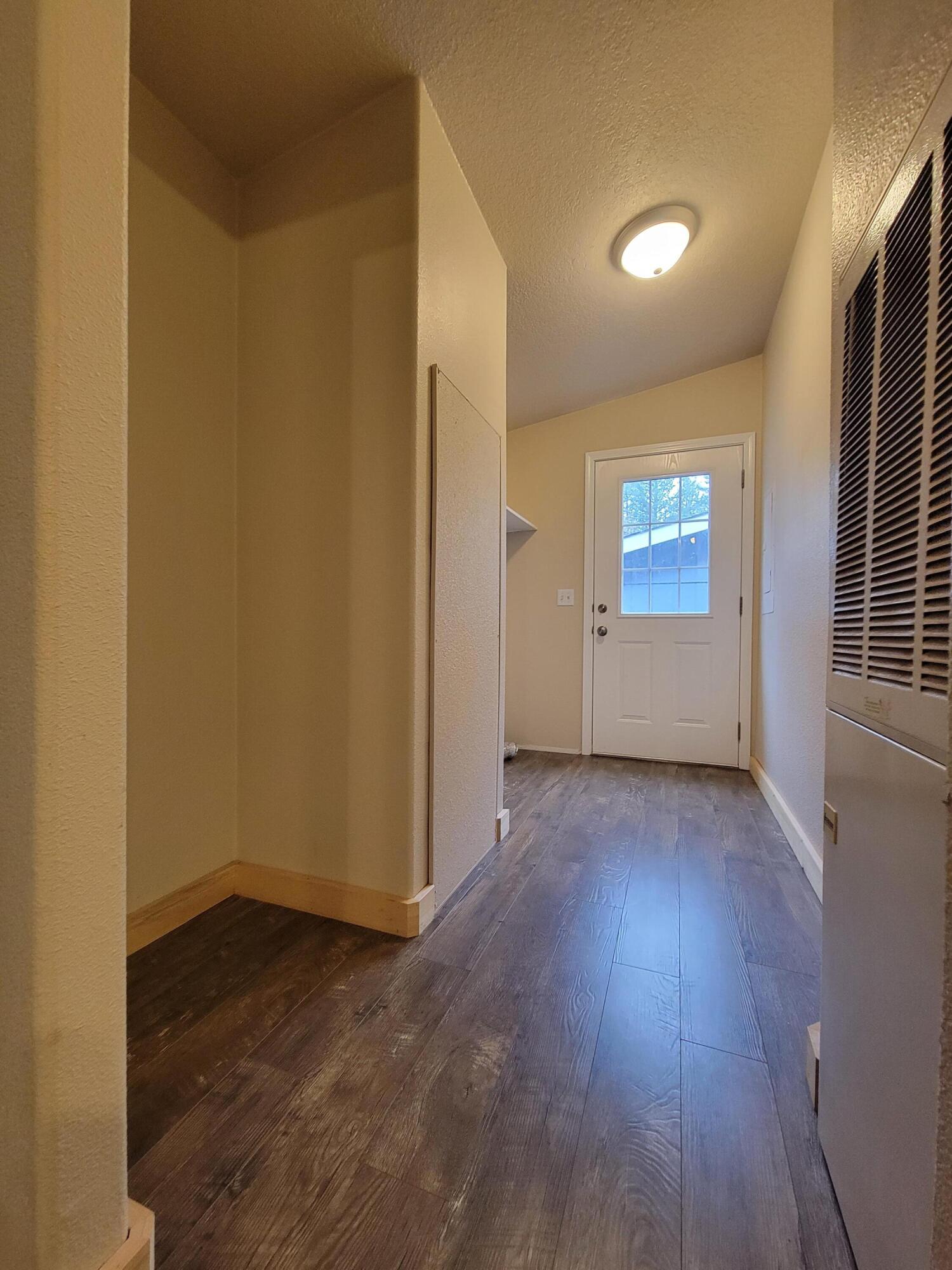 447 Fee Street Butte Falls, OR 97522 - Photo 11 of 16 Laundry room leading to back door.