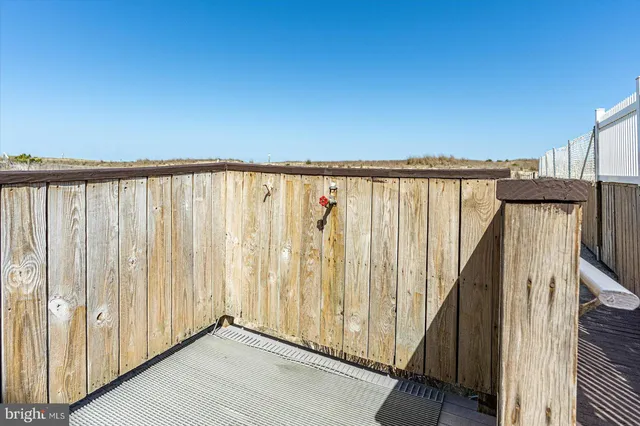 a view of a kitchen with a sink and cabinets