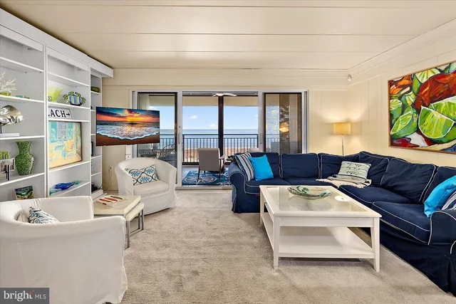 a kitchen with cabinets and chairs