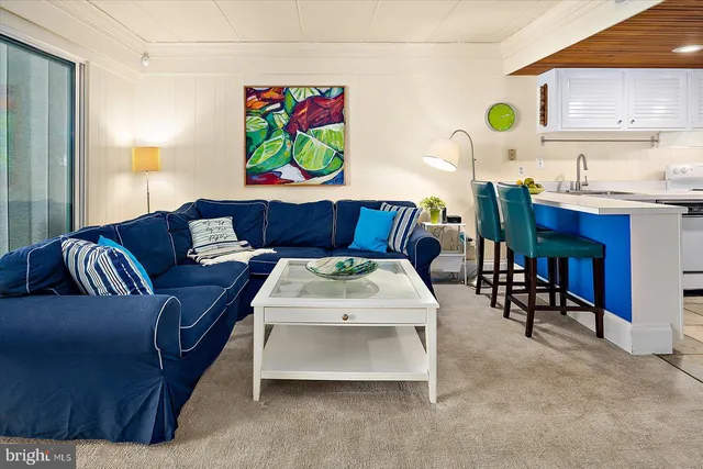 a dining room with furniture and a chandelier