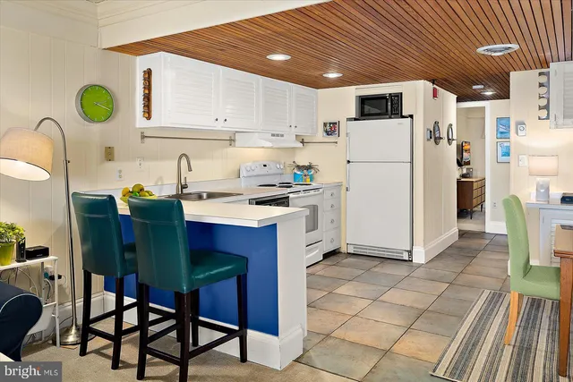 a spacious bedroom with a bed and a desk