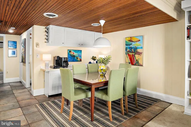 a view of a bedroom with furniture and wooden floor