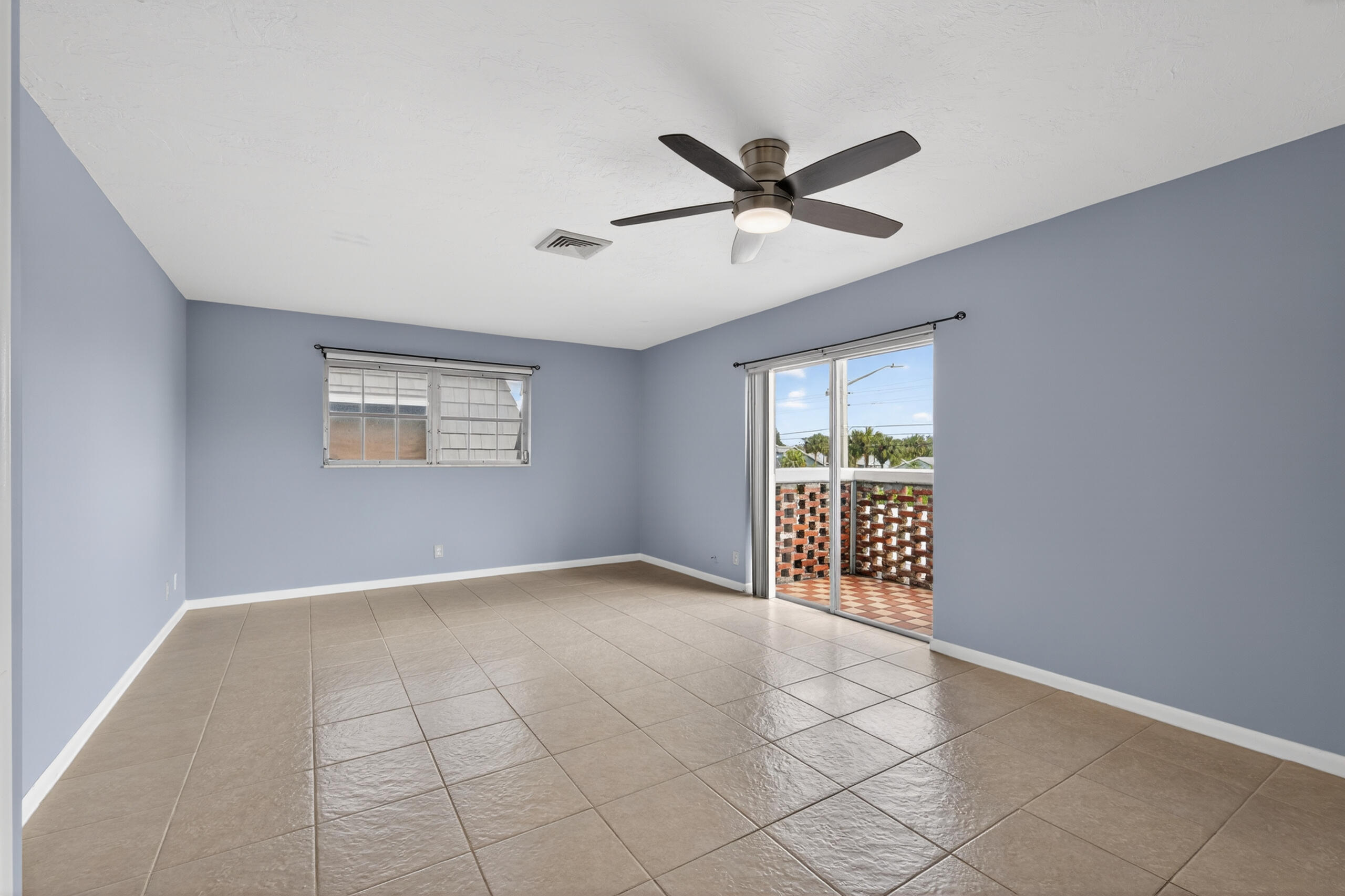 423 Pine Tree Court, Unit 23 Atlantis, FL 33462 - Photo 16 of 33 a view of an empty room with a window