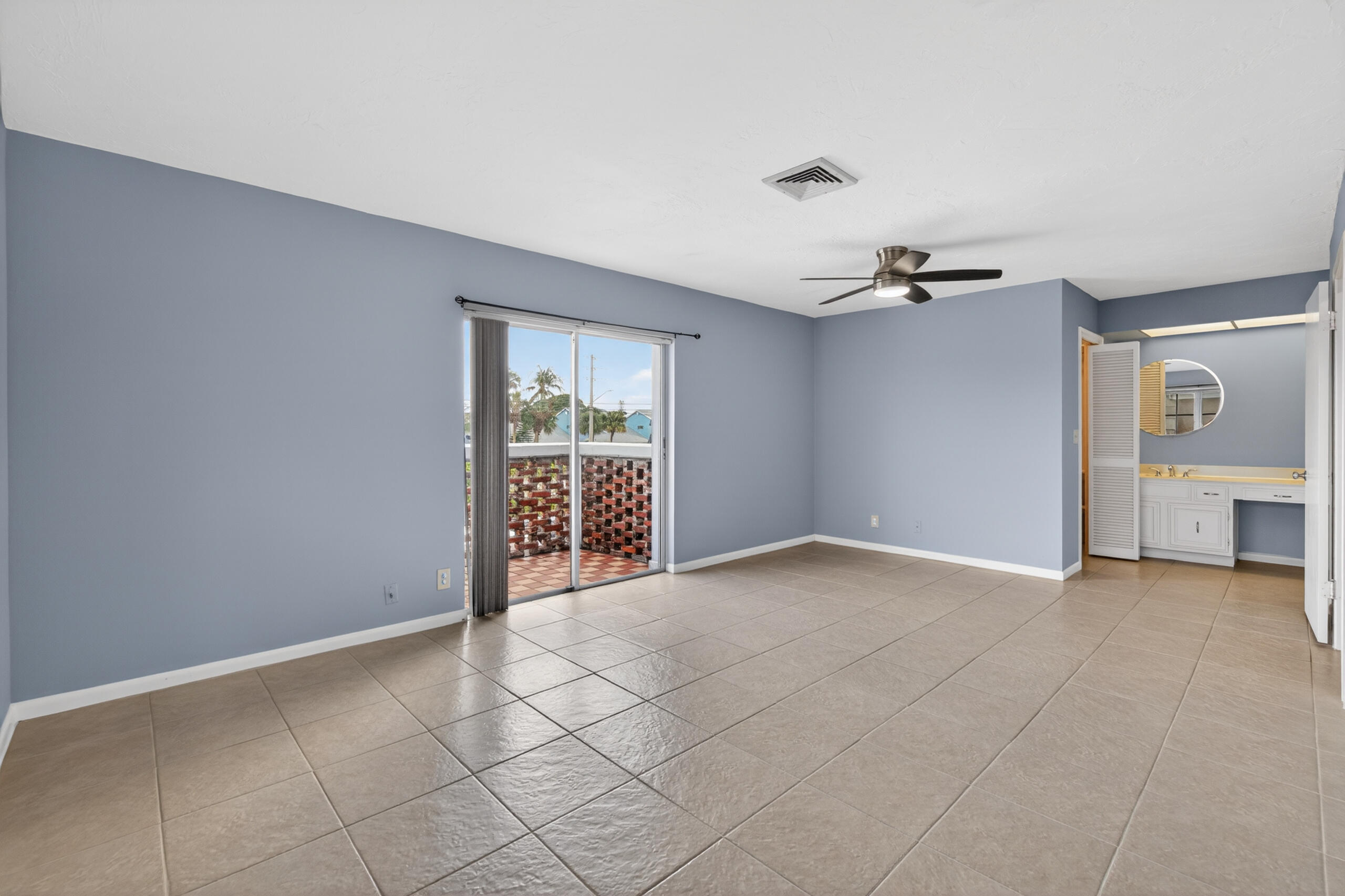 423 Pine Tree Court, Unit 23 Atlantis, FL 33462 - Photo 18 of 33 a view of an empty room with a window