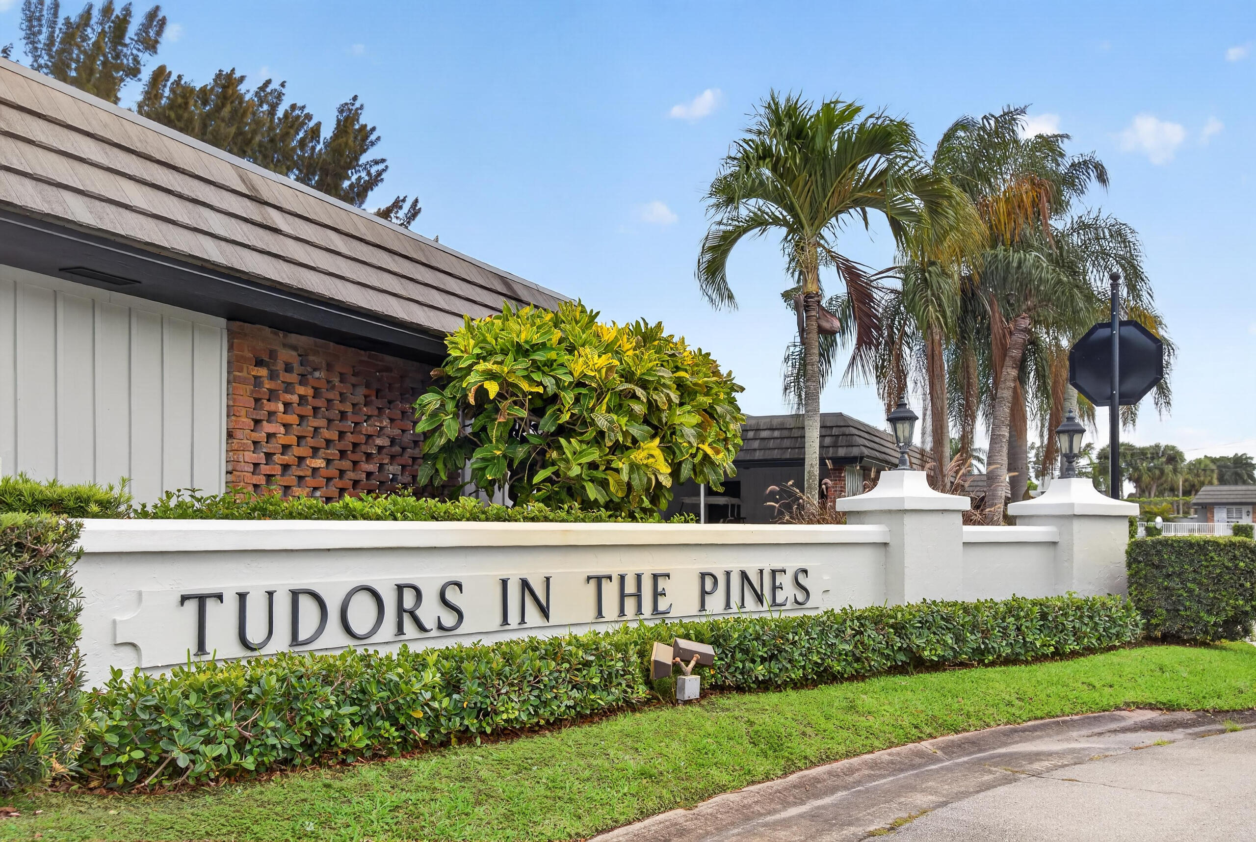 423 Pine Tree Court, Unit 23 Atlantis, FL 33462 - Photo 24 of 33 a view of sign board with flower around