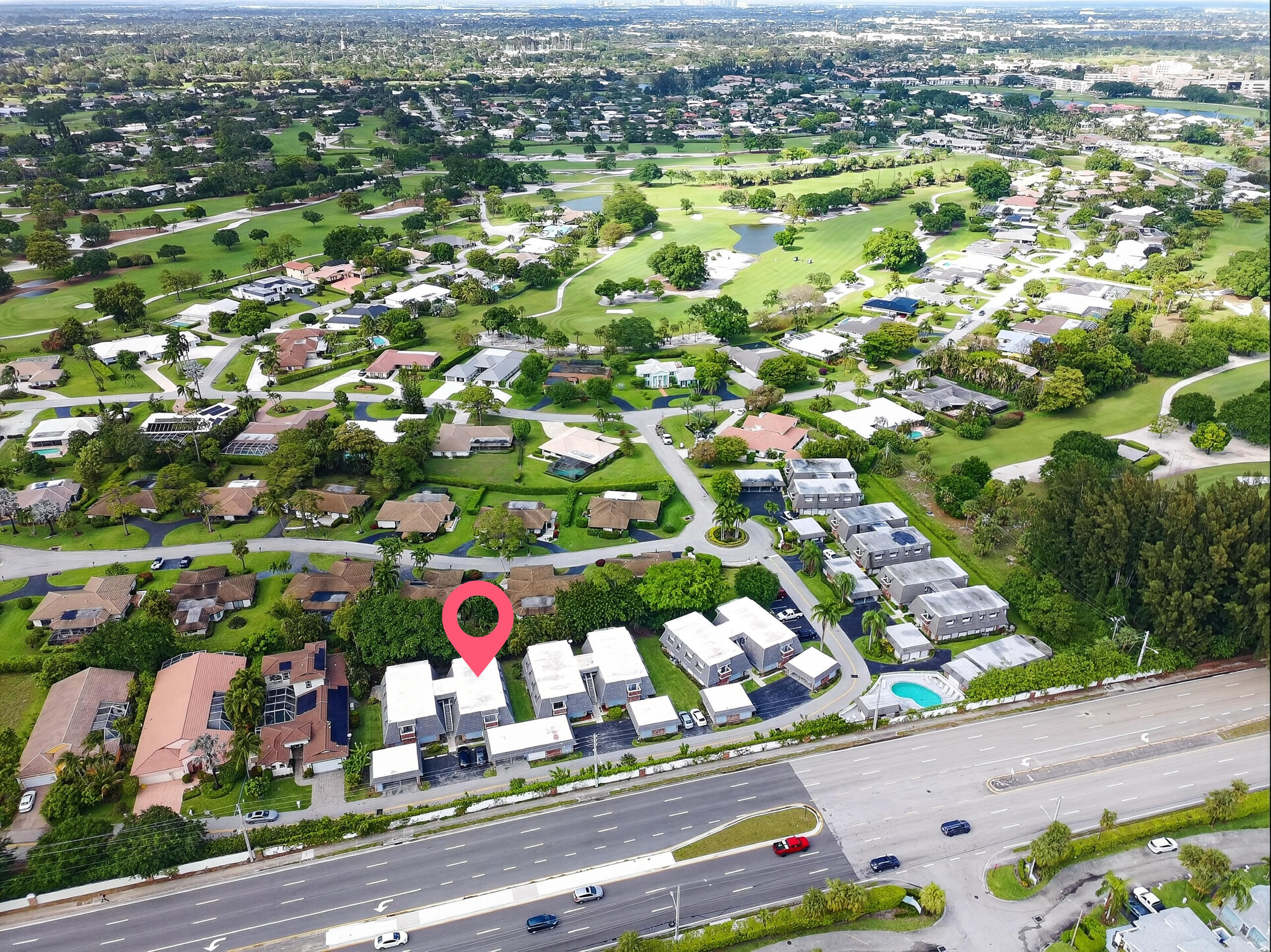423 Pine Tree Court, Unit 23 Atlantis, FL 33462 - Photo 31 of 33 an aerial view of residential houses with outdoor space