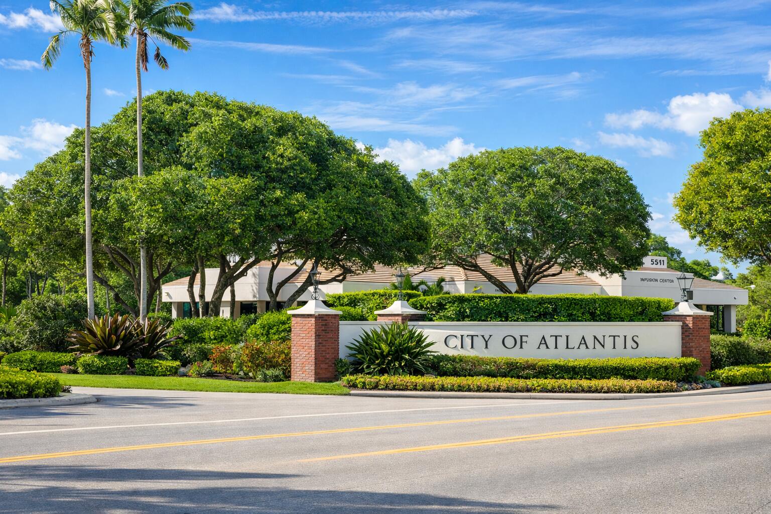423 Pine Tree Court, Unit 23 Atlantis, FL 33462 - Photo 33 of 33 a street sign on a side of a building