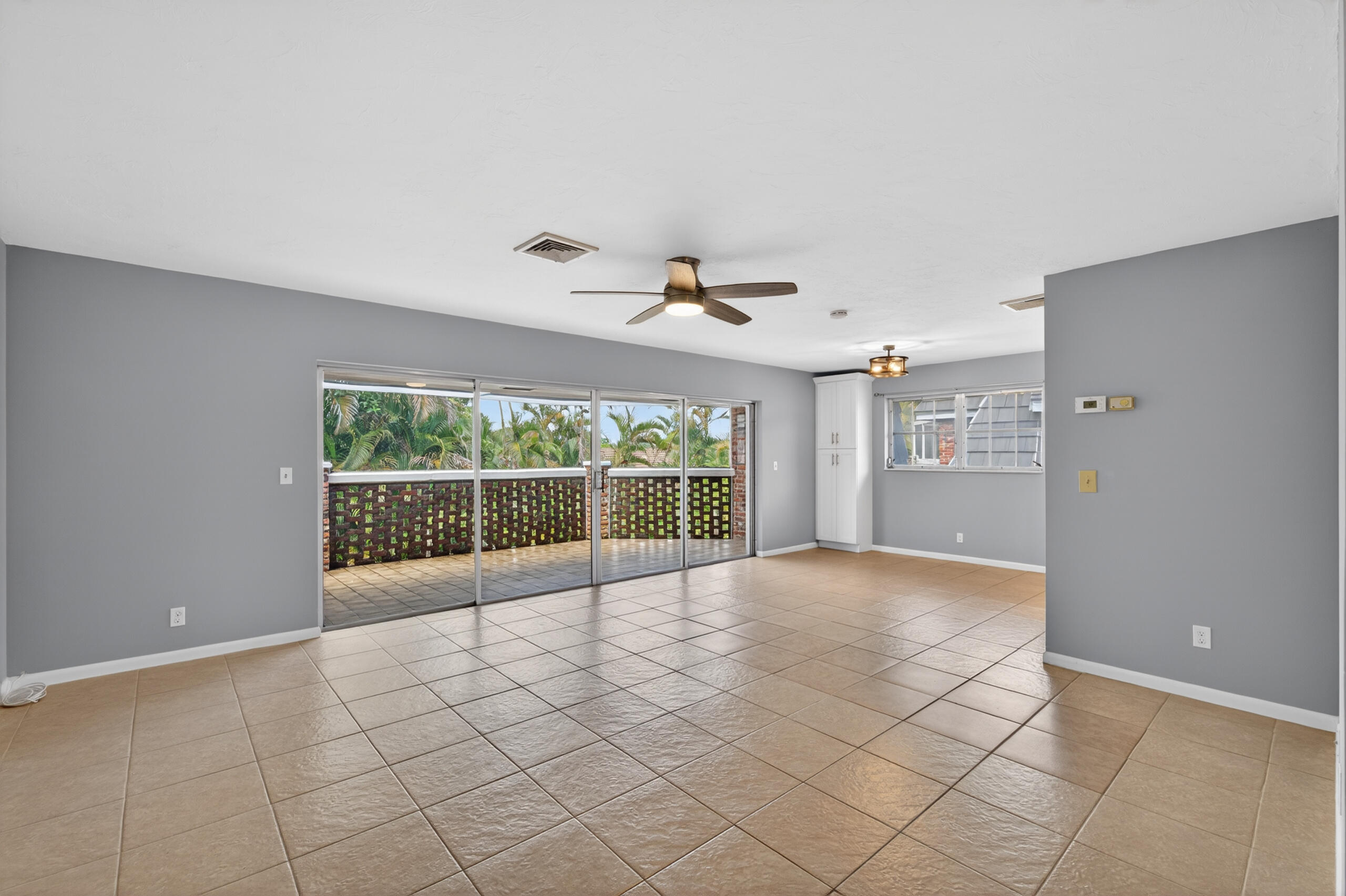 423 Pine Tree Court, Unit 23 Atlantis, FL 33462 - Photo 4 of 33 a view of an empty room with a window