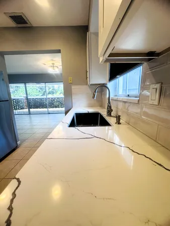 $2,500 | 423 Pine Tree Court, Unit 23, Atlantis, FL 33462