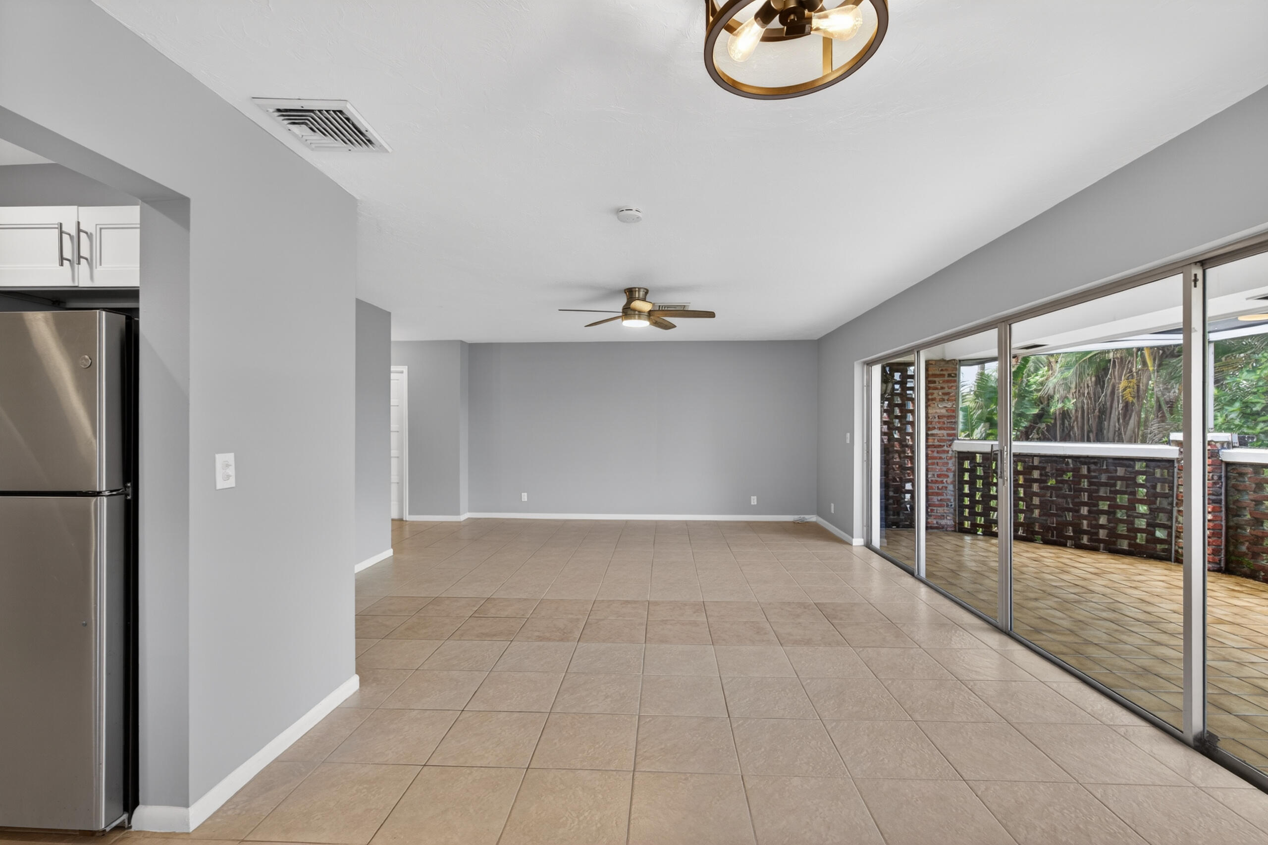 423 Pine Tree Court, Unit 23 Atlantis, FL 33462 - Photo 9 of 33 a view of an empty room with a window