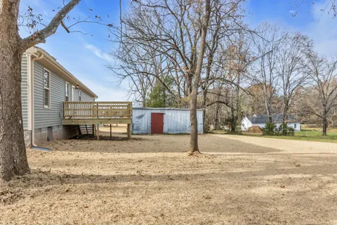 a view of a yard with a snow on the road