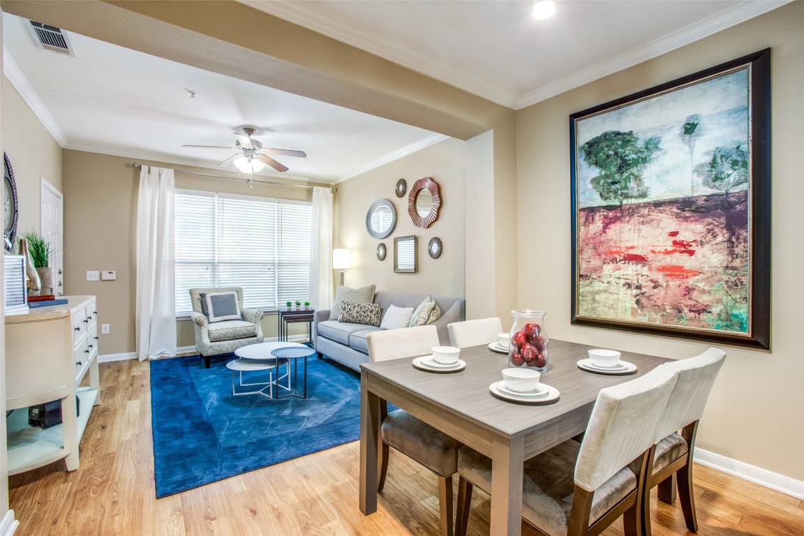 10221 Centrepark Drive, Unit A735 Houston, TX 77043 - Photo 4 of 16 a view of a dining room with furniture window and wooden floor