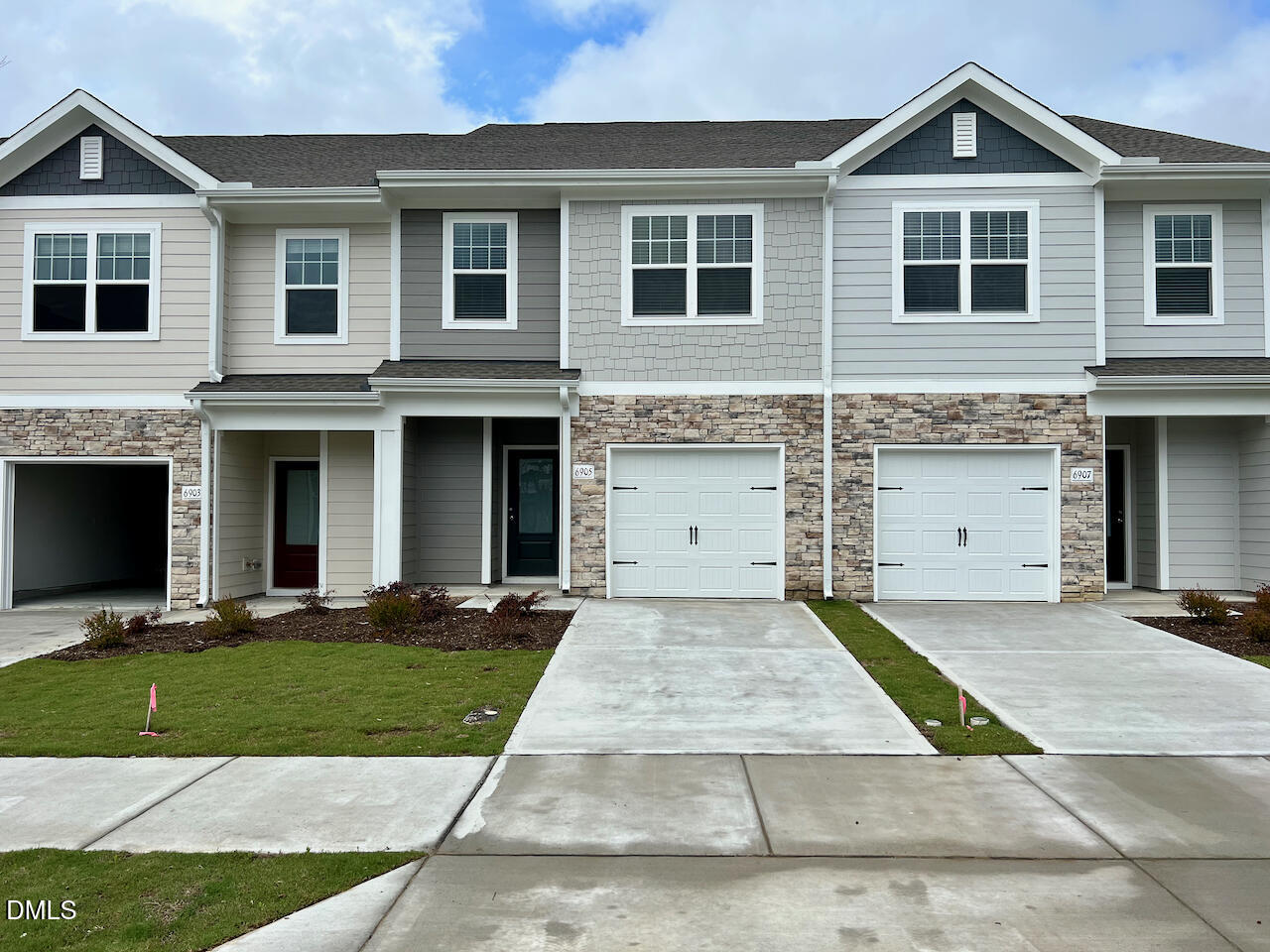 a front view of a house with yard
