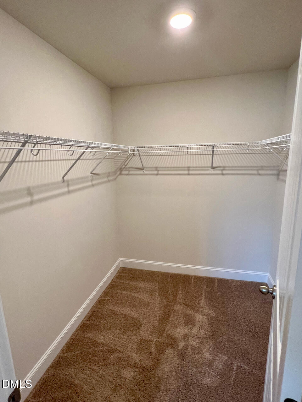 6905 Outfall Point Lane Raleigh, NC 27616 - Photo 15 of 44 a view of a room with racks on the wall