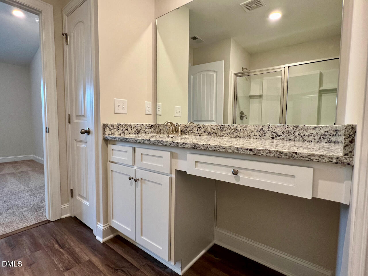 6905 Outfall Point Lane Raleigh, NC 27616 - Photo 20 of 44 a bathroom with a sink and a mirror