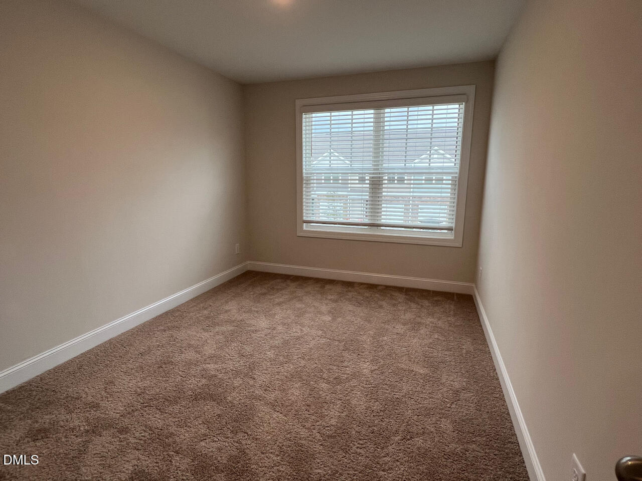 6905 Outfall Point Lane Raleigh, NC 27616 - Photo 23 of 44 an empty room with a window