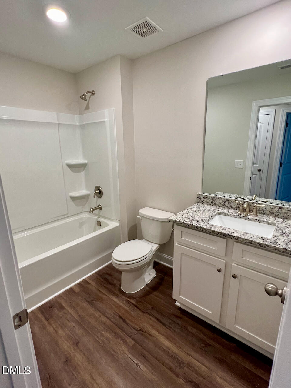 6905 Outfall Point Lane Raleigh, NC 27616 - Photo 29 of 44 a bathroom with a granite countertop toilet sink and mirror