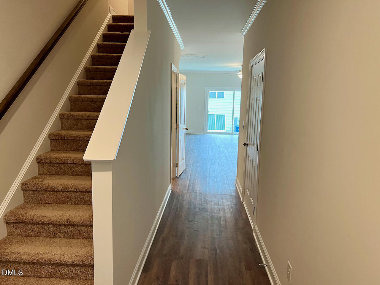 6905 Outfall Point Lane Raleigh, NC 27616 - Photo 4 of 44 a view of a hallway with wooden floor and entryway