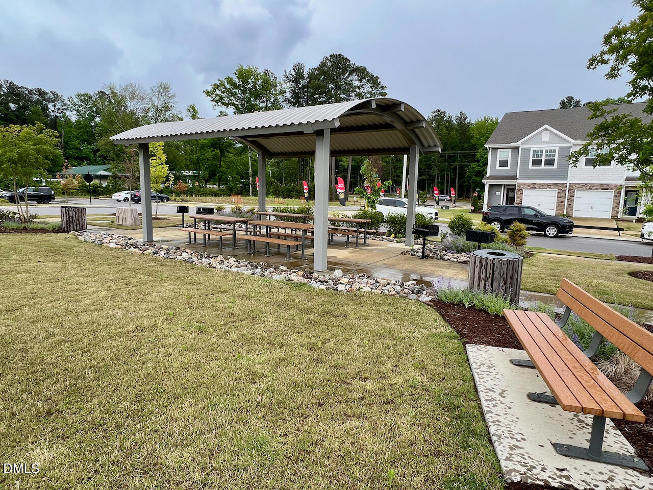 6905 Outfall Point Lane Raleigh, NC 27616 - Photo 42 of 44 a view of a patio with table and chairs under an umbrella