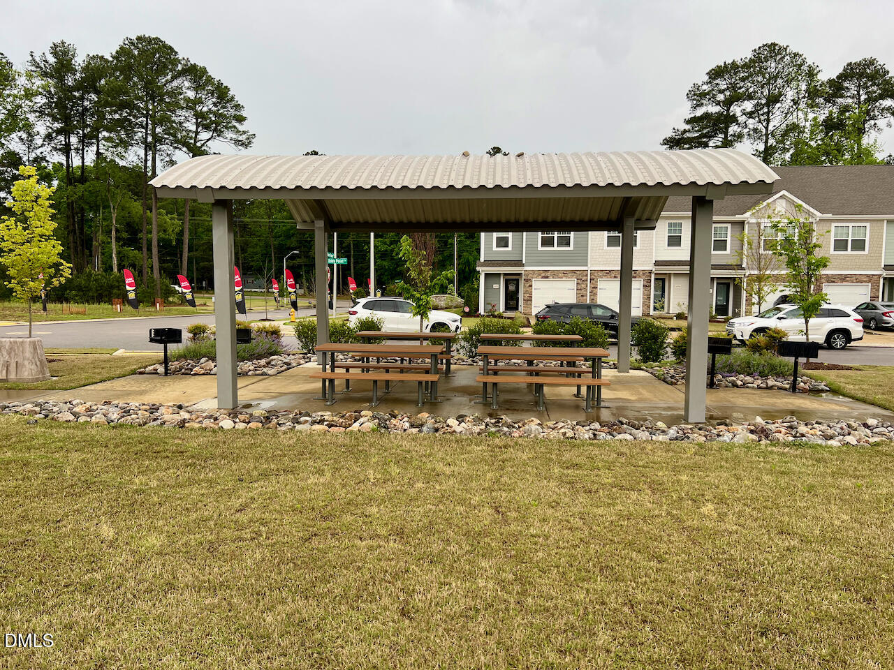 6905 Outfall Point Lane Raleigh, NC 27616 - Photo 43 of 44 a view of a patio with table and chairs potted plants and large tree