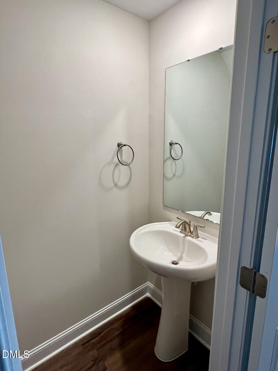 6905 Outfall Point Lane Raleigh, NC 27616 - Photo 5 of 44 a bathroom with a sink toilet and a mirror
