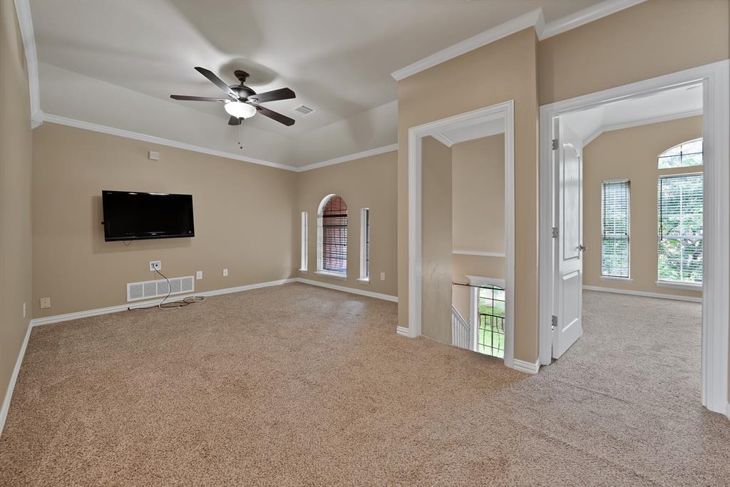 1110 McCampbell Road Mansfield, TX 76063 - Photo 26 of 39 a view of a livingroom with an empty space and a ceiling fan