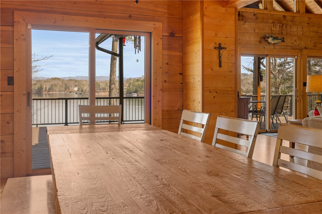 109 Deer Laurel Way Salem, SC 29676 - Photo 11 of 50 This inviting dining area features ample space for gatherings with serene lake and mountain views.