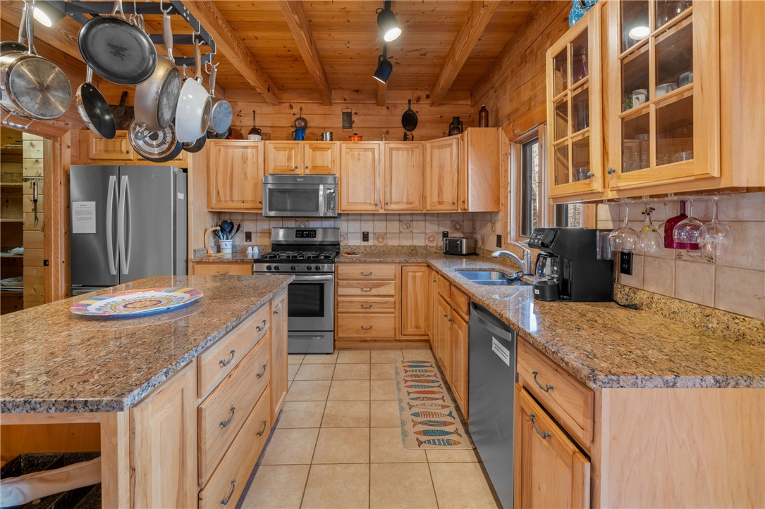 109 Deer Laurel Way Salem, SC 29676 - Photo 14 of 50 This kitchen blends rustic charm with modern functionality, featuring natural wood finishes and ample counter space.