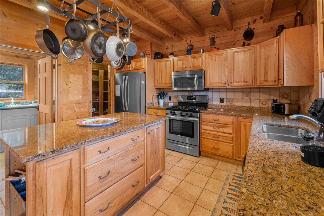 109 Deer Laurel Way Salem, SC 29676 - Photo 15 of 50 A well-appointed kitchen features ample counter space, rich wood cabinetry, and modern appliances.