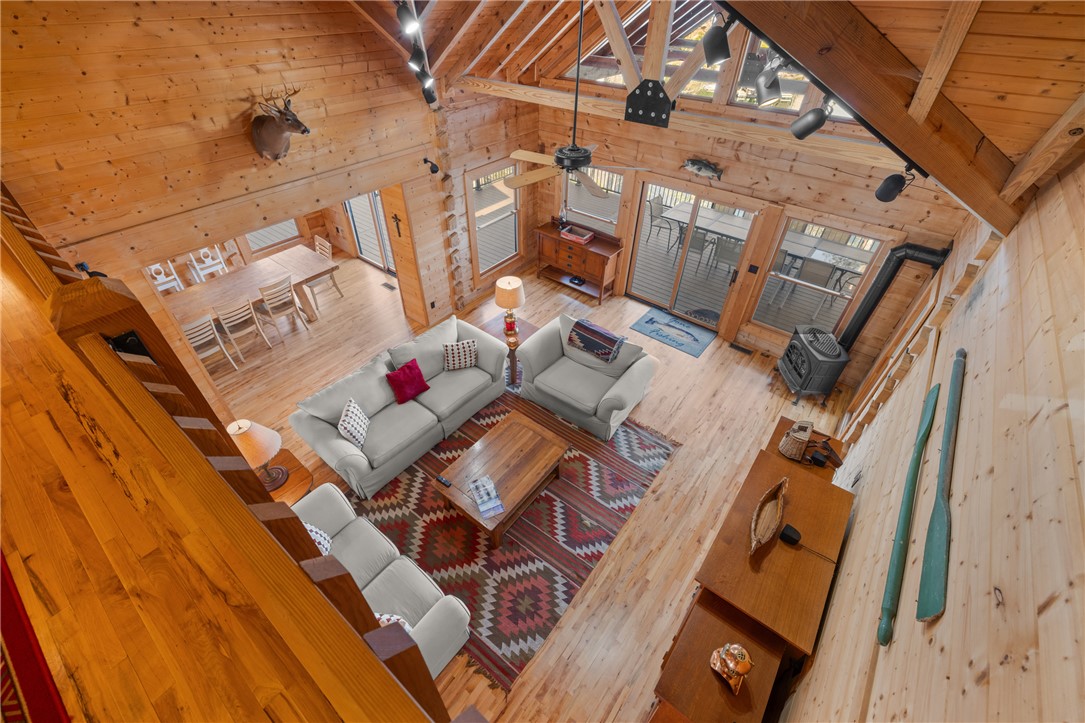 109 Deer Laurel Way Salem, SC 29676 - Photo 24 of 50 An inviting open-concept living space features high ceilings and natural wood finishes throughout.