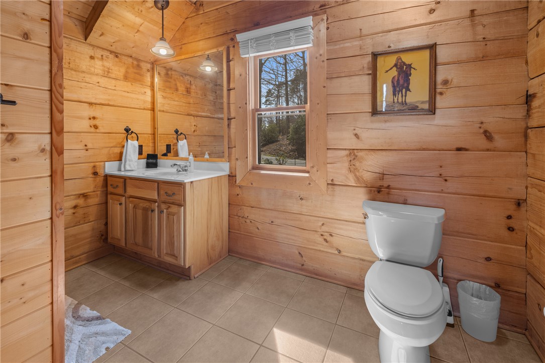 109 Deer Laurel Way Salem, SC 29676 - Photo 28 of 50 This bathroom features warm wooden walls, a functional vanity.