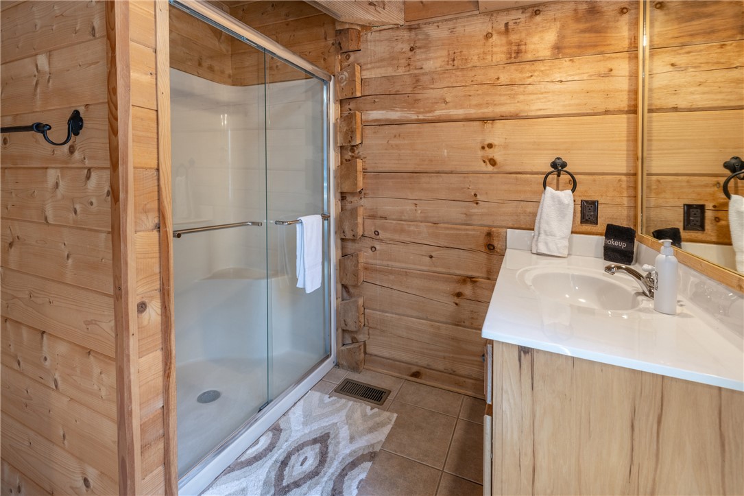 109 Deer Laurel Way Salem, SC 29676 - Photo 29 of 50 This bathroom features a sleek glass-enclosed shower and a vanity with a pristine countertop.
