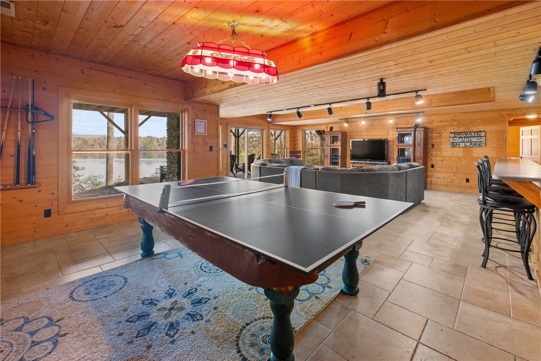 109 Deer Laurel Way Salem, SC 29676 - Photo 32 of 50 This inviting great room with wood paneling offers an expansive space for entertaining and relaxing by the lake.