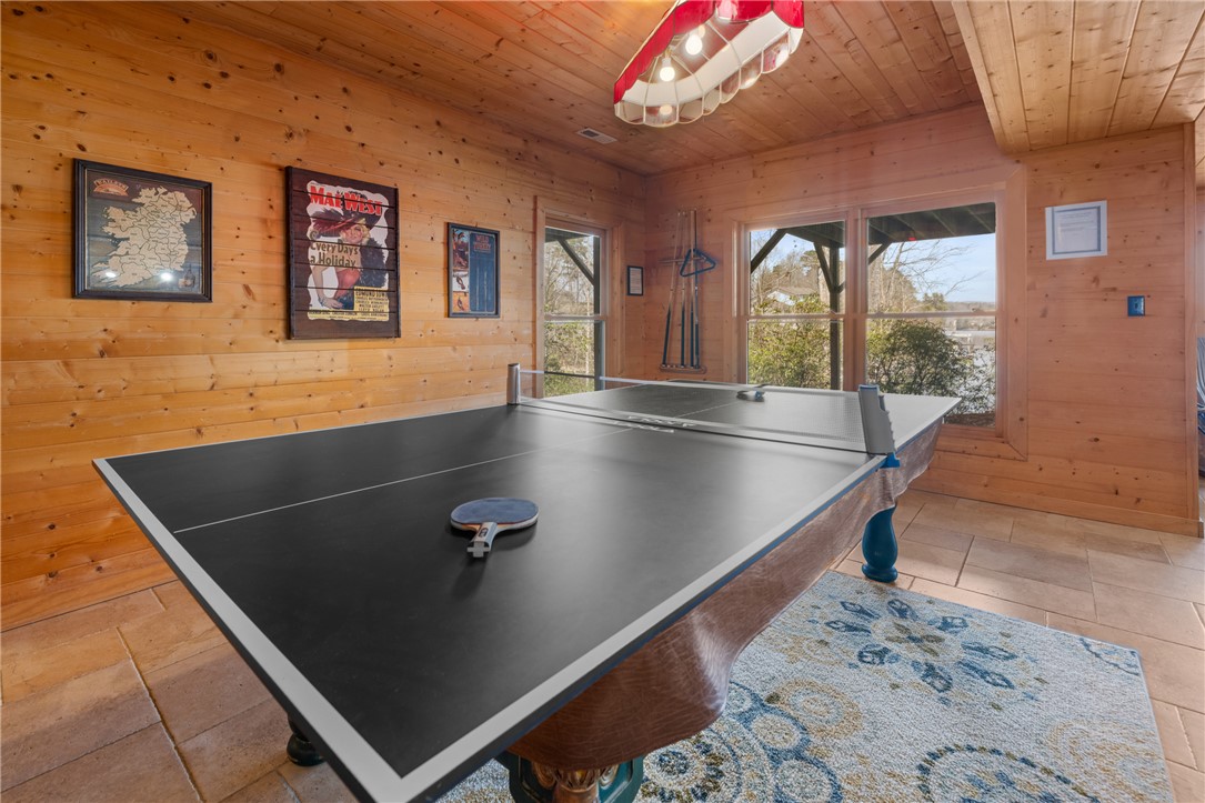 109 Deer Laurel Way Salem, SC 29676 - Photo 33 of 50 This versatile recreation room offers a fun atmosphere with warm wood paneling and ample natural light.