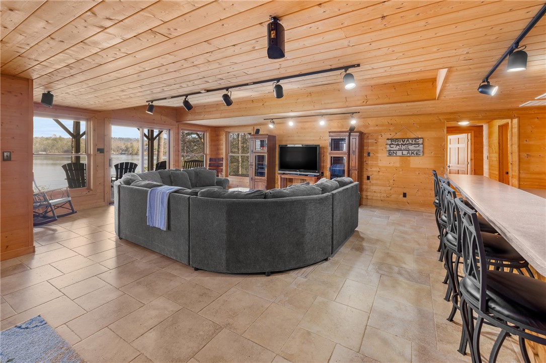 109 Deer Laurel Way Salem, SC 29676 - Photo 34 of 50 This living area features rich wood paneling, tile flooring, and ample natural light.