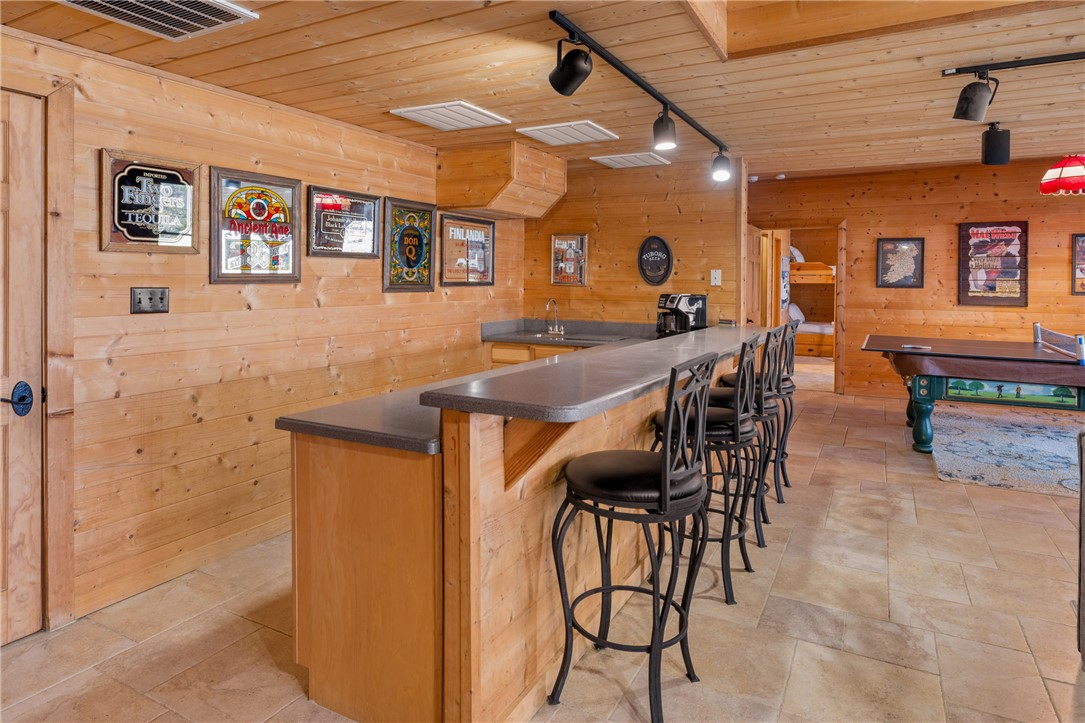 109 Deer Laurel Way Salem, SC 29676 - Photo 38 of 50 An inviting entertainment space featuring a classic bar and recreational amenities.
