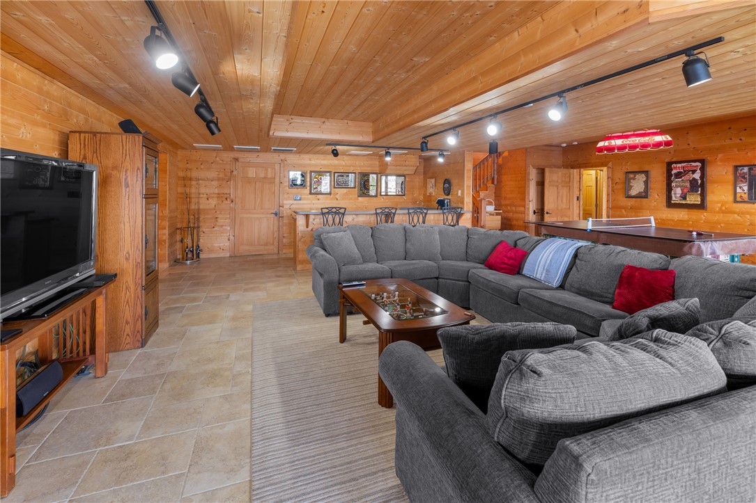 109 Deer Laurel Way Salem, SC 29676 - Photo 39 of 50 This versatile recreation room features warm wood paneling and ample space for entertaining.