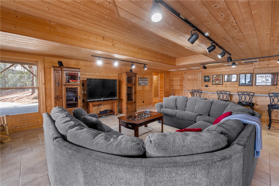 109 Deer Laurel Way Salem, SC 29676 - Photo 40 of 50 This inviting living space features warm wood paneling and ample seating for gatherings.