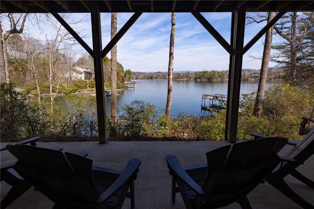 109 Deer Laurel Way Salem, SC 29676 - Photo 48 of 50 This inviting patio offers panoramic lake views, perfect for peaceful mornings or serene evenings.