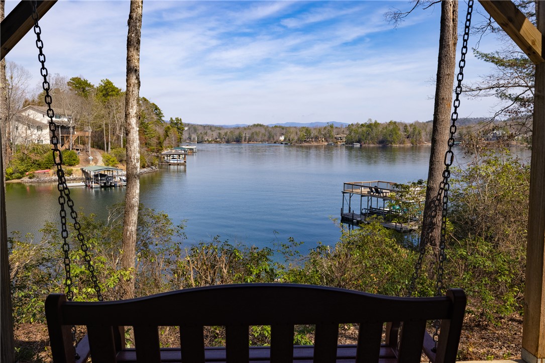 109 Deer Laurel Way Salem, SC 29676 - Photo 49 of 50 Enjoy tranquil lake views from this inviting porch, perfect for relaxation.