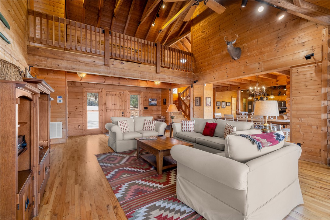 109 Deer Laurel Way Salem, SC 29676 - Photo 7 of 50 This expansive great room features rustic wooden beams and a cozy atmosphere.