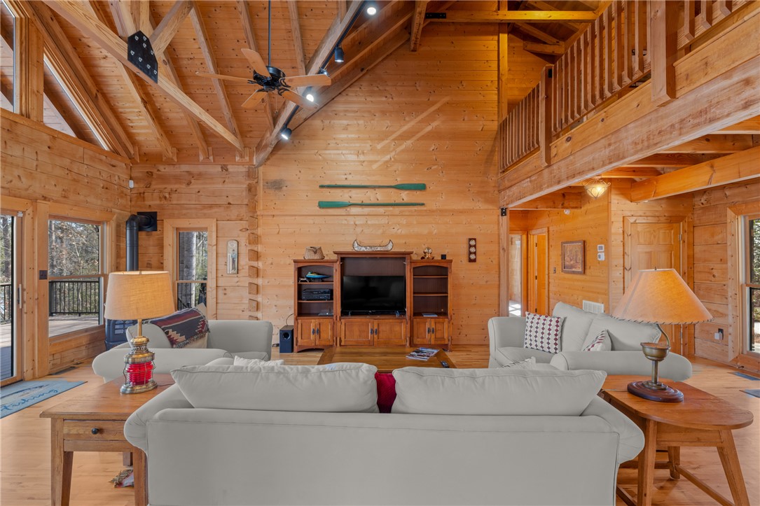 109 Deer Laurel Way Salem, SC 29676 - Photo 8 of 50 This living room boasts high vaulted ceilings, offering a bright and spacious gathering area.